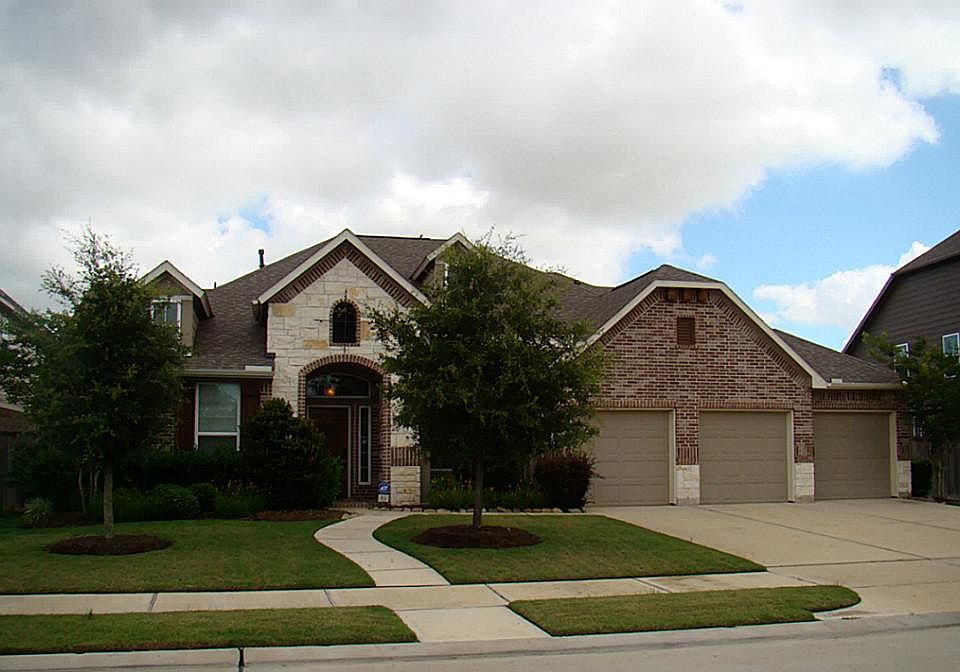 This beautiful 1.5 story house has a 3 1/2 car garage, 4 bedrooms, 4.5 baths, 2 gamerooms/flex space