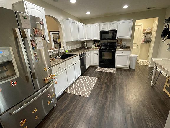 New large sink, new stainless steel dishwasher, french door fridge with large freezer space. New tile backsplash.