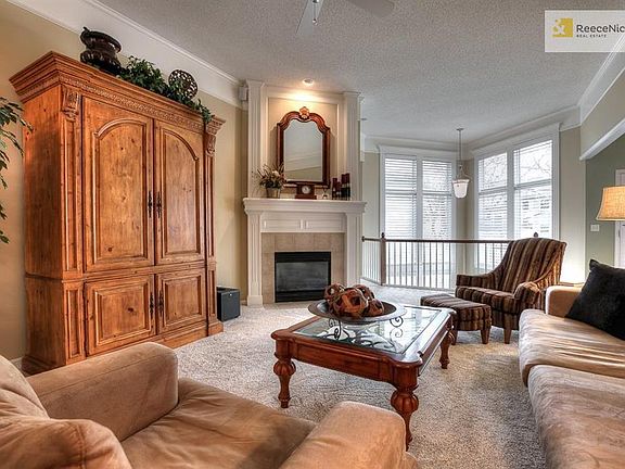 Spacious great room with corner fireplace