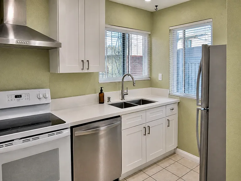 BRAND NEW remodeled kitchen, new countertops, cabinets, sink, faucet, blinds and appliances
