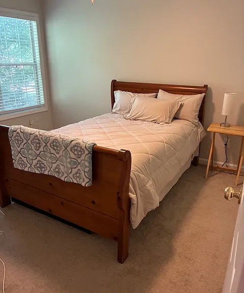 furnished room has bed and dresser and closet