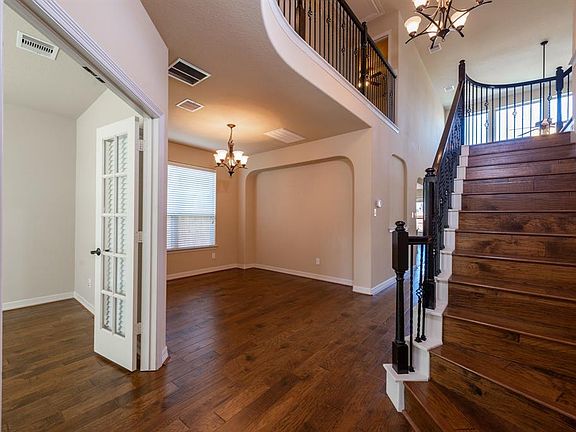 Front foyer, study and dining with designer niches