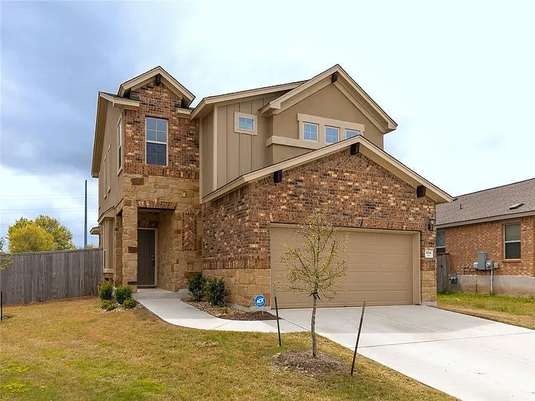 Double garage and covered entrance
