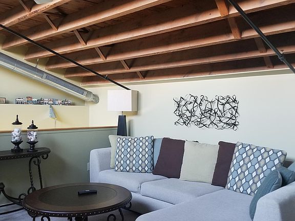 The loft space is large enough for a sectional sofa and large TV.