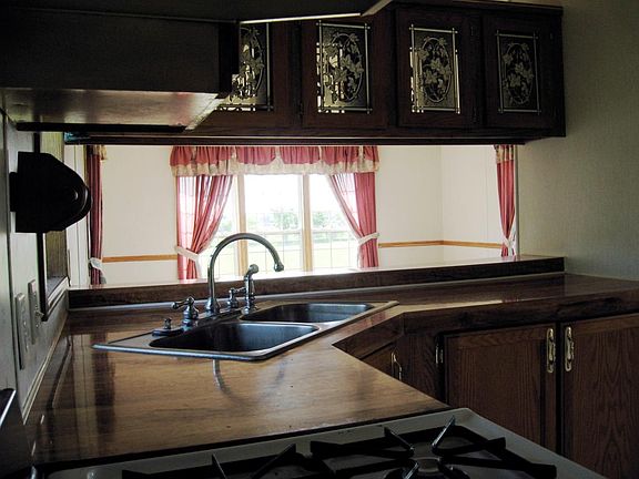 KITCHEN, LIVING ROOM IN BACKGROUND