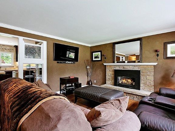 Living room with gas fireplace with remote control.