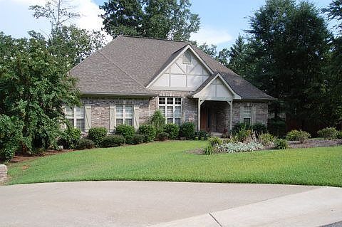 Beautifully landscaped with lots of trees.