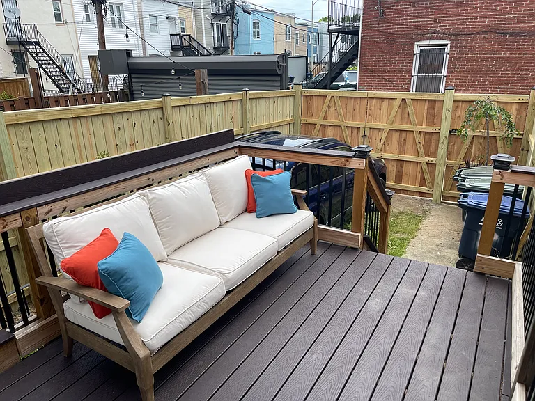 Rear deck with off-street gated parking space