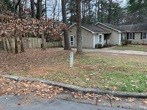 The home includes a large front yard extending from the cul de sac to the street.