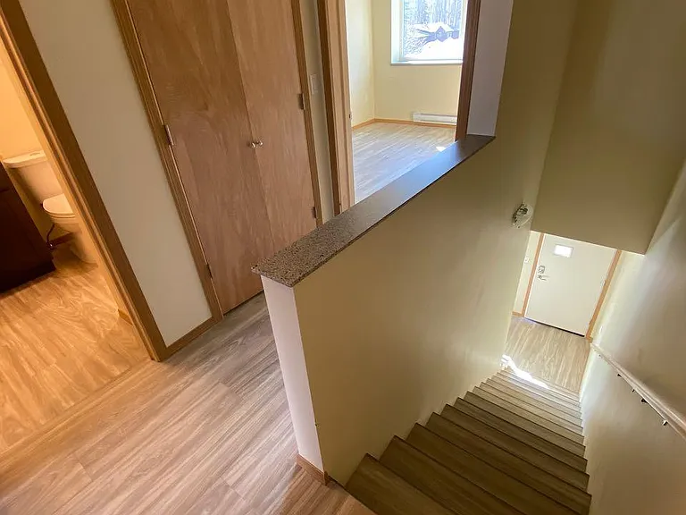 Landing at top of stairs, looking at full bathroom, hall closet front bedroom, then downstairs
