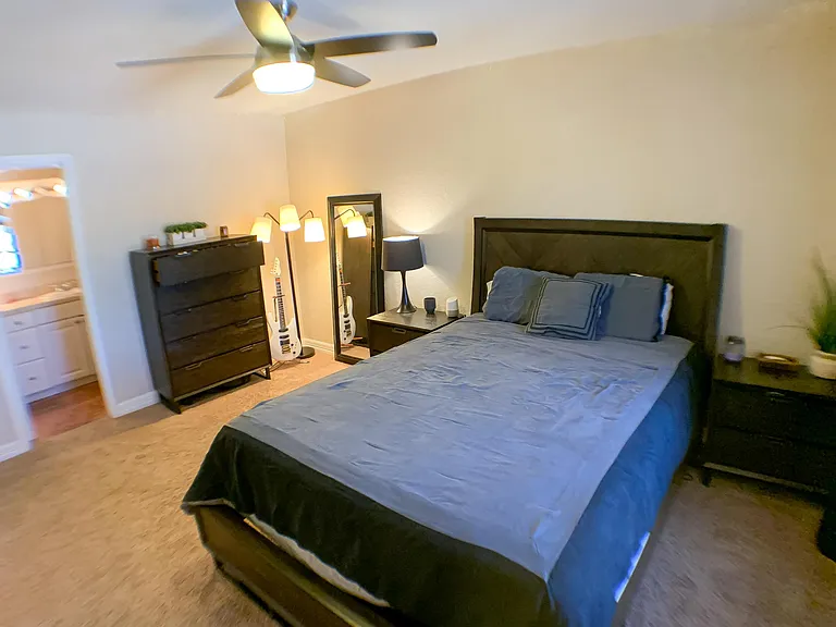 Bedroom includes a private bathroom and two walk-in closets with built-in storage shelves - makes this space perfect for couples.