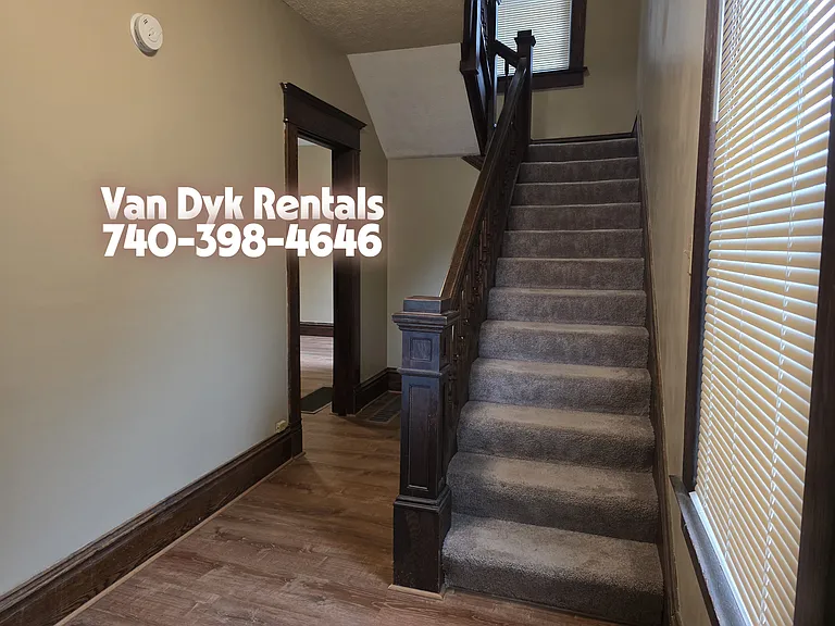 Foyer facing stairs, hall into dining room, to the left, living room, not pictured here.