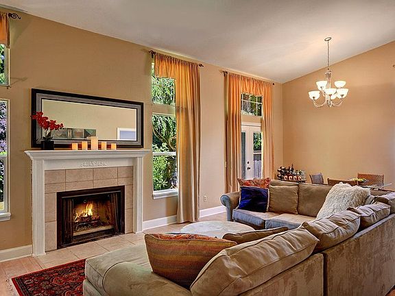 Living Room, Dining Room, Fireplace ..... all with a Vaulted Ceiling