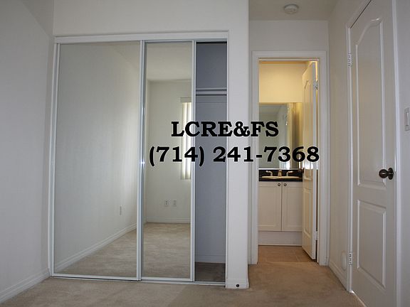 Bedroom with mirror closet