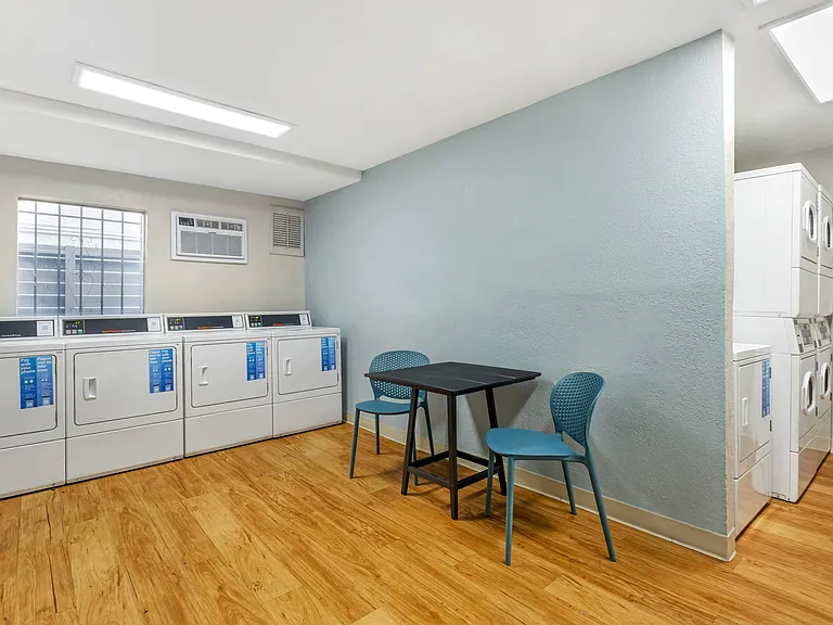 Refreshingly inviting: Where laundry day becomes a delightful retreat. Sit back, relax, and let the ambiance of our newly renovated communal laundry room elevate your chore experience.