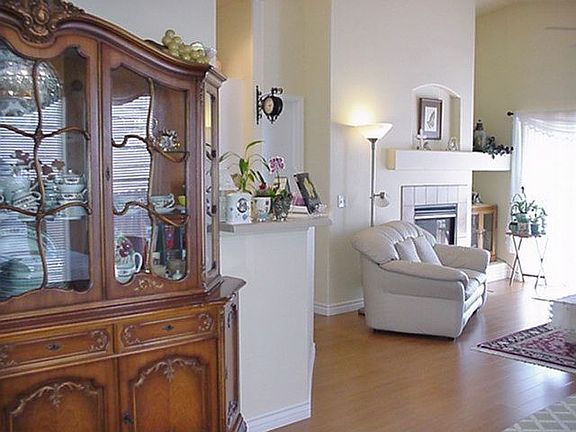 CHINA CABINET WALL LOOKING INTO LIVING ROOM