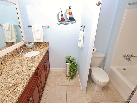 Master Bathroom with Custom Cherry Cabinets and Granite Coun