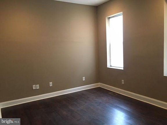 Living room with 2 large windows in front of house