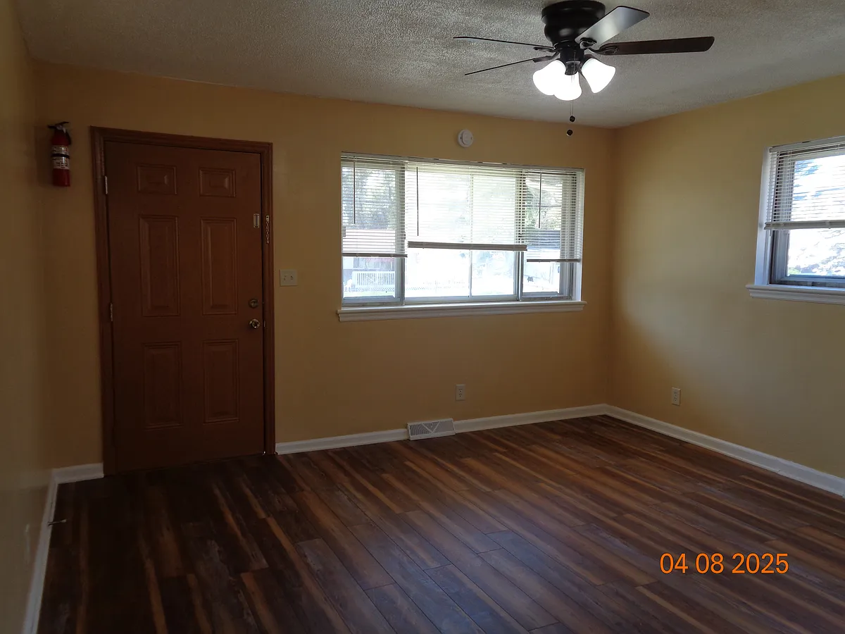 Living room with front Entry door - 3707 Troutland Ave NW
