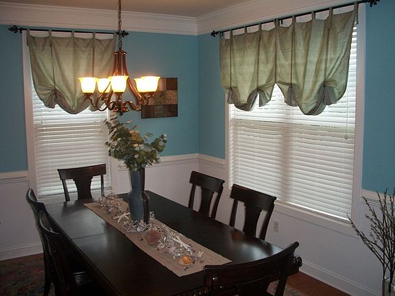 Dining Room with Crown Molding and Chair Rail