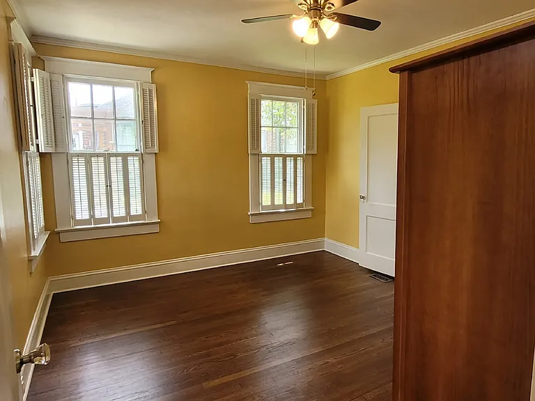 Back bedroom. All bedrooms have ceiling fans with lights.