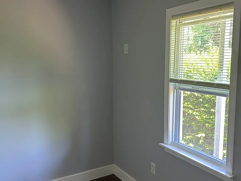 Bedroom #3 with large window.