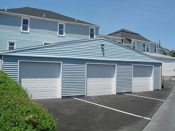 middle garage (oversized) plus space for small car outside