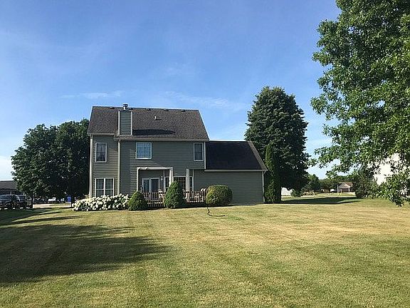 Back of house with yard