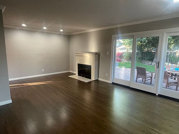 Living Room Leading out to Patio and Beautiful Redwoods