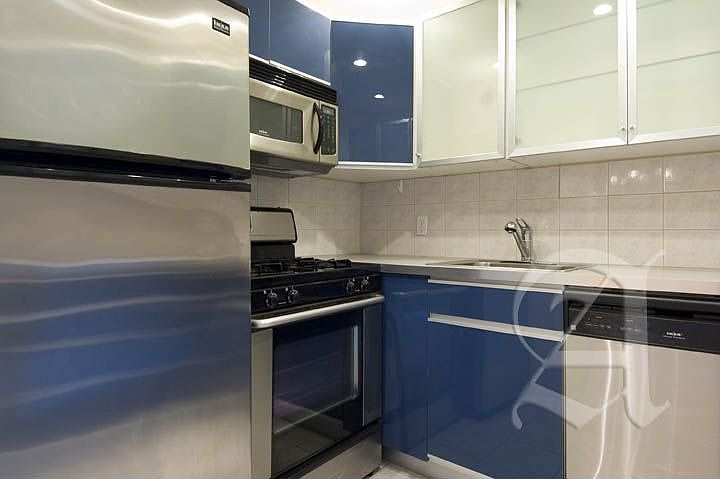 Kitchen (left). Call Mandy L. Harwood to show: 617-477-6837 x3