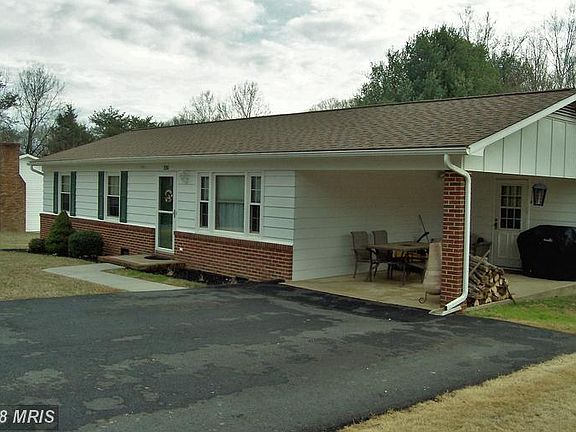 Carport with concrete floor.