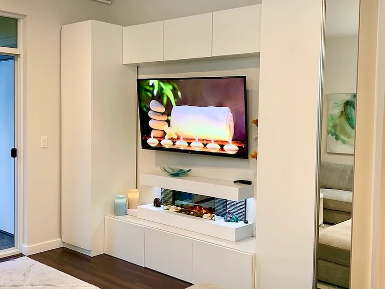 Custom built-in media wall with modern fireplace