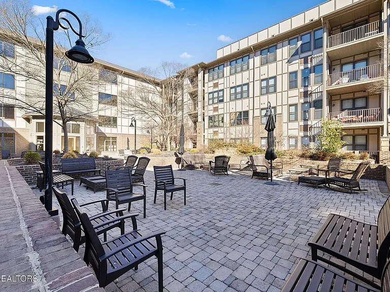 courtyard with fountain and grill