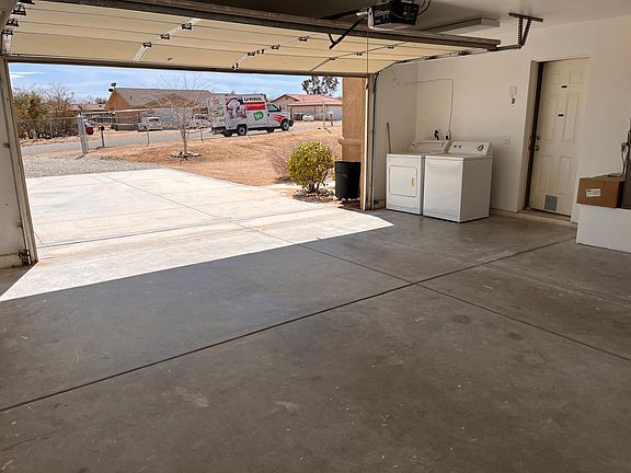 Attached garage with automatic garage door opener and washer and dryer
