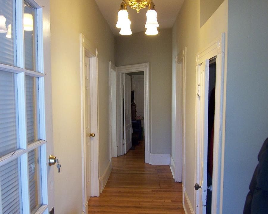 Foyer with coat closet and front bathroom and bedroom doors
