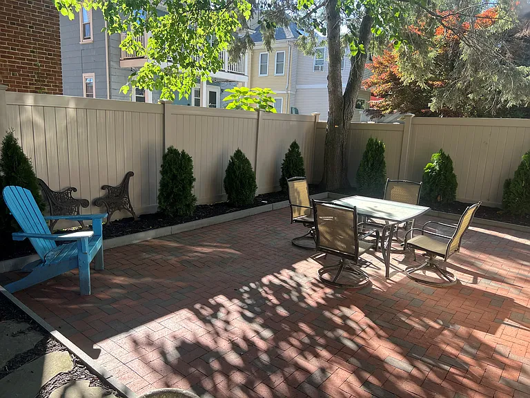 Shared brick patio in back.