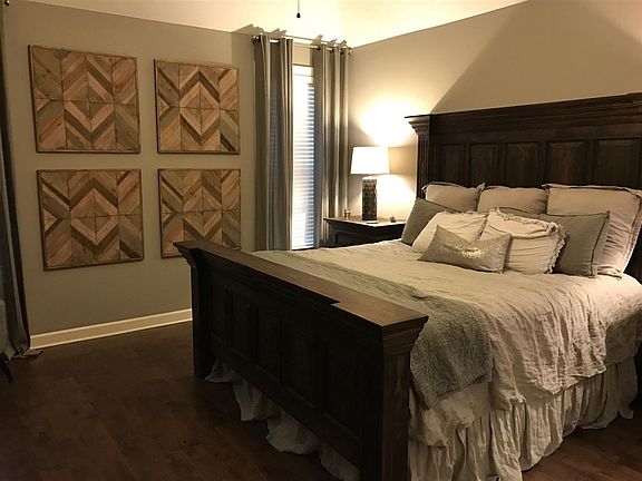 Large Master Bedroom with hardwood floors and coffered ceiling