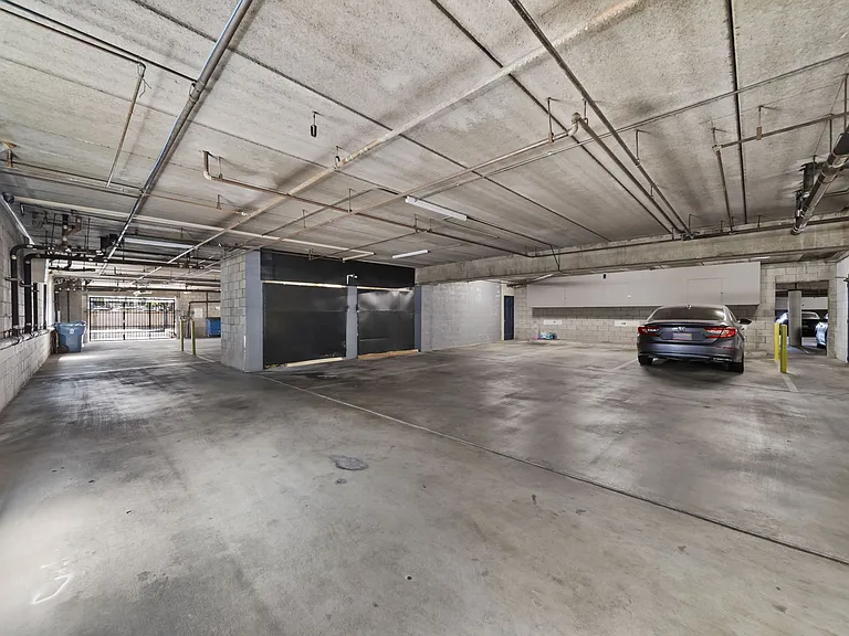 Secure, gated parking garage offering ample covered parking for resident convenience.