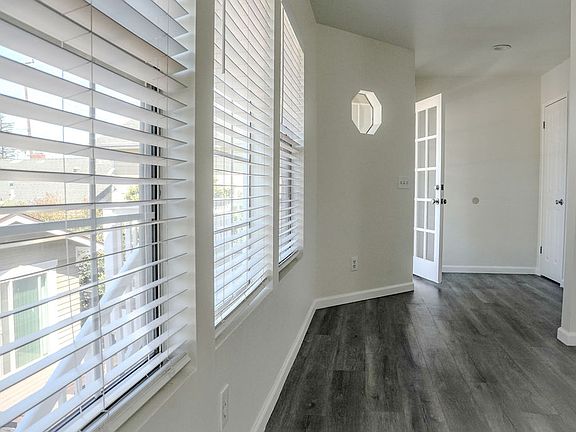 Front door entrance with adjacent coat closet.