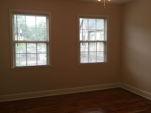 bedroom with two windows and closet