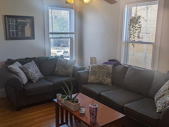 Livingroom has hardwood floors and ceiling fan