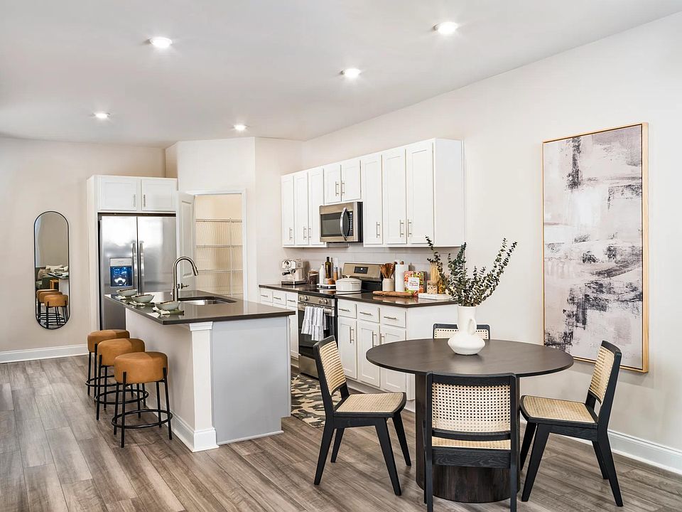 Unleash your inner chef and effortlessly entertain with the large chef's island, featuring built-in storage.