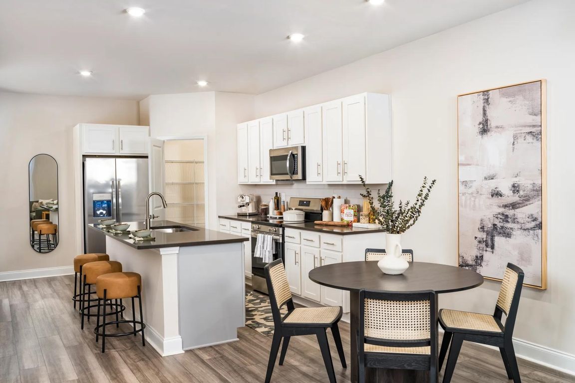 Unleash your inner chef and effortlessly entertain with the large chef's island, featuring built-in storage.