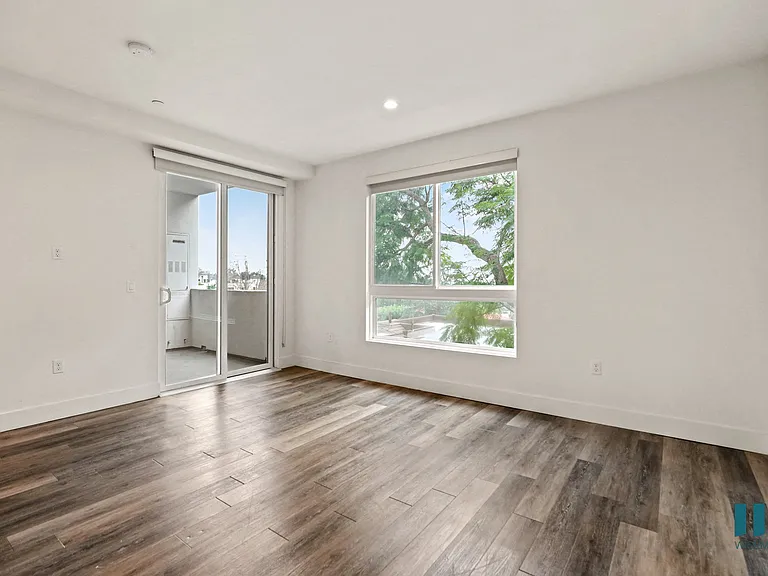 Bedroom with Patio, Vinyl Flooring, and Large-Size Windows