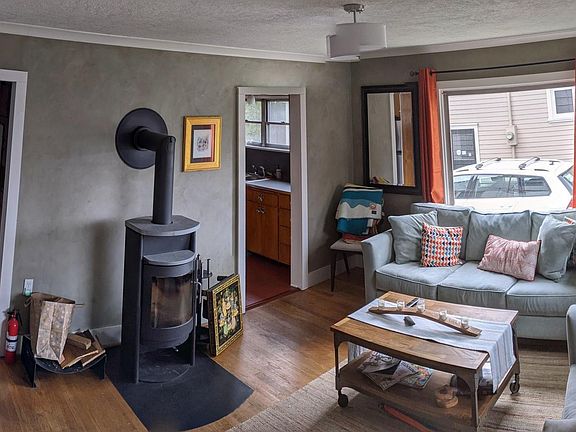 Living room with wood stove (furniture not included)