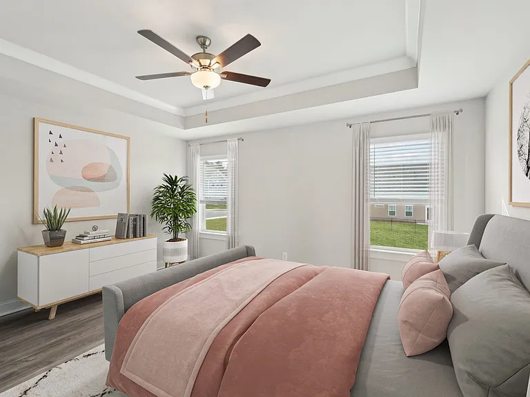 Primary Bedroom with king size bed and large window letting in nice natural light.