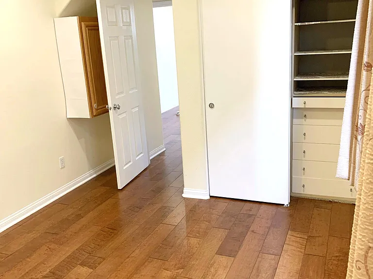 Bedroom #2 (First floor). View from far end of room. Comes with abundant storage