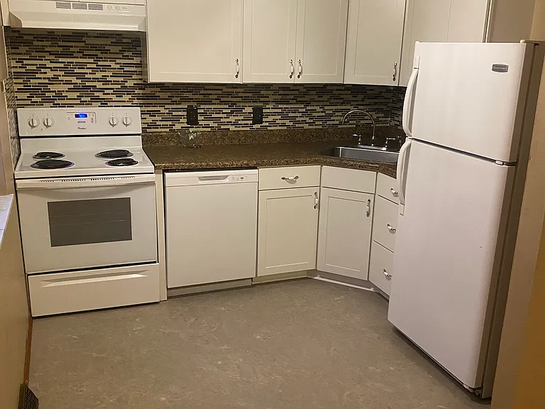 View of Kitchen. Updated cabinets - newer appliances.