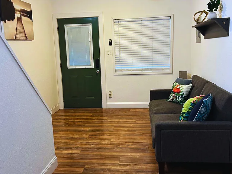Modern living space with charming decor and cozy seating.