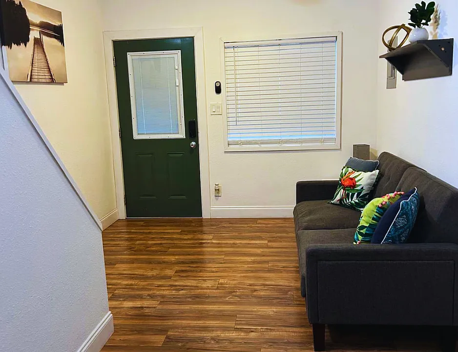 Modern living space with charming decor and cozy seating.